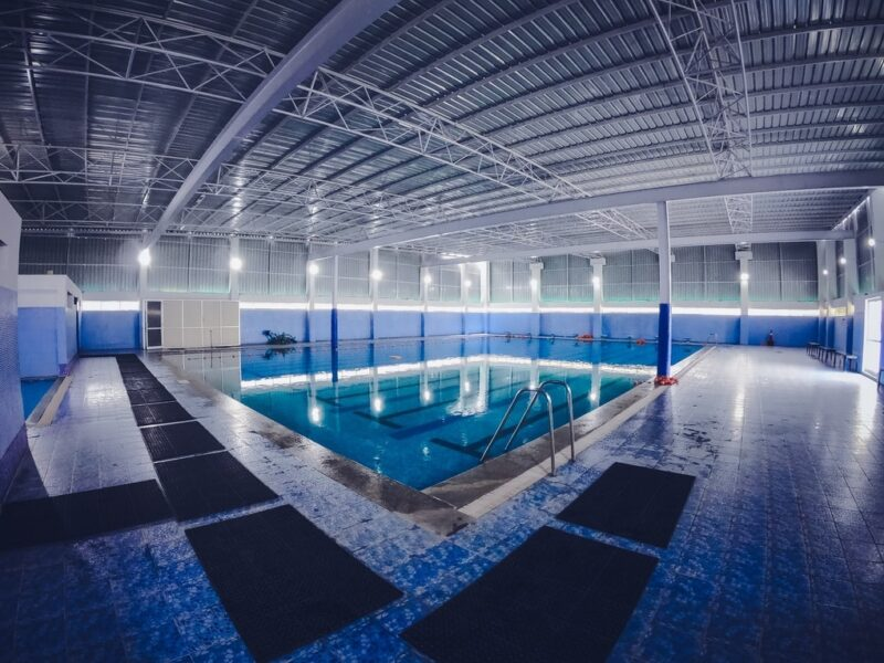 Modern pool interior with blue ambient lighting