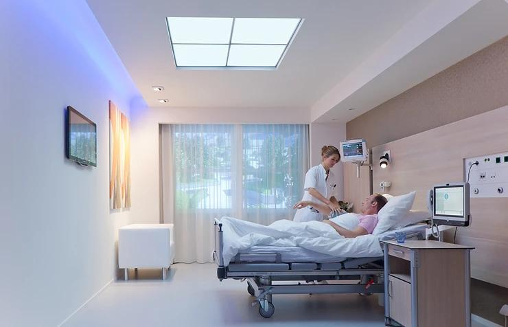 Modern hospital patient room with AI-controlled lighting installation