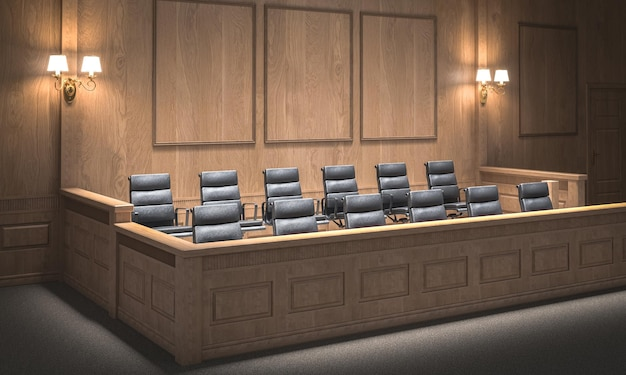 Empty jury box in a county courthouse with neutral downlighting and witness stand visible in the background