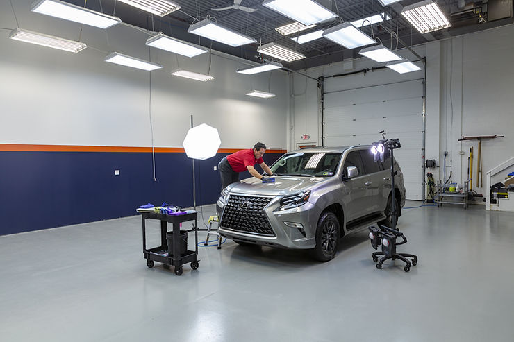 Auto detailing workspace with professional LED lighting for paint correction
