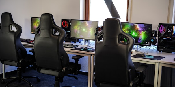 Esports team practice room with row of gaming stations and task lighting