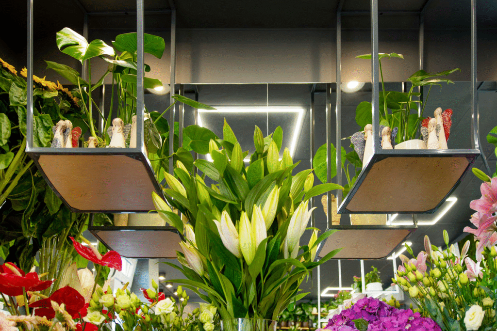 Florist shop interior with professional display lighting showing fresh flower arrangements