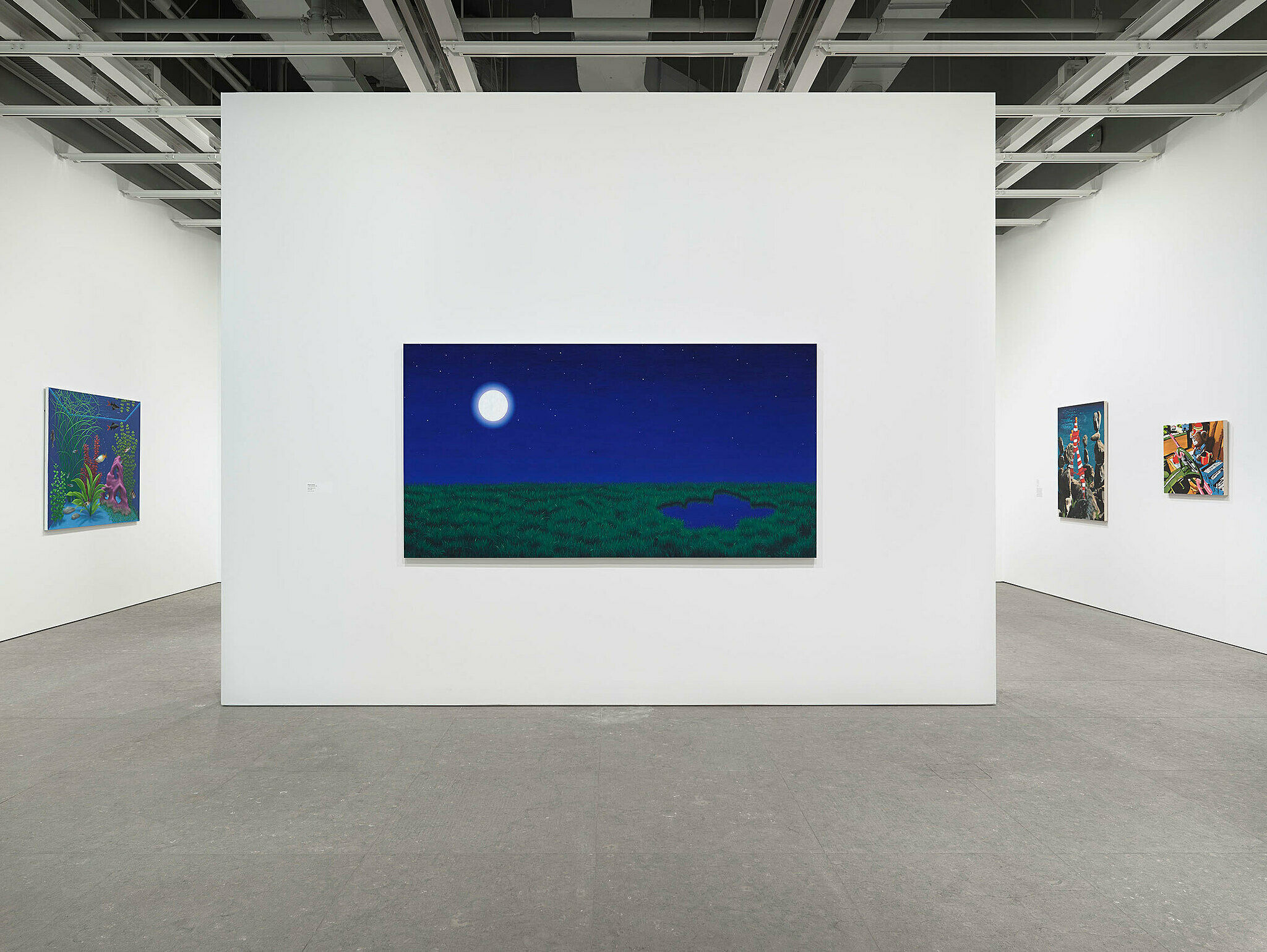 Modern art gallery interior with white walls and track lighting illuminating paintings on display