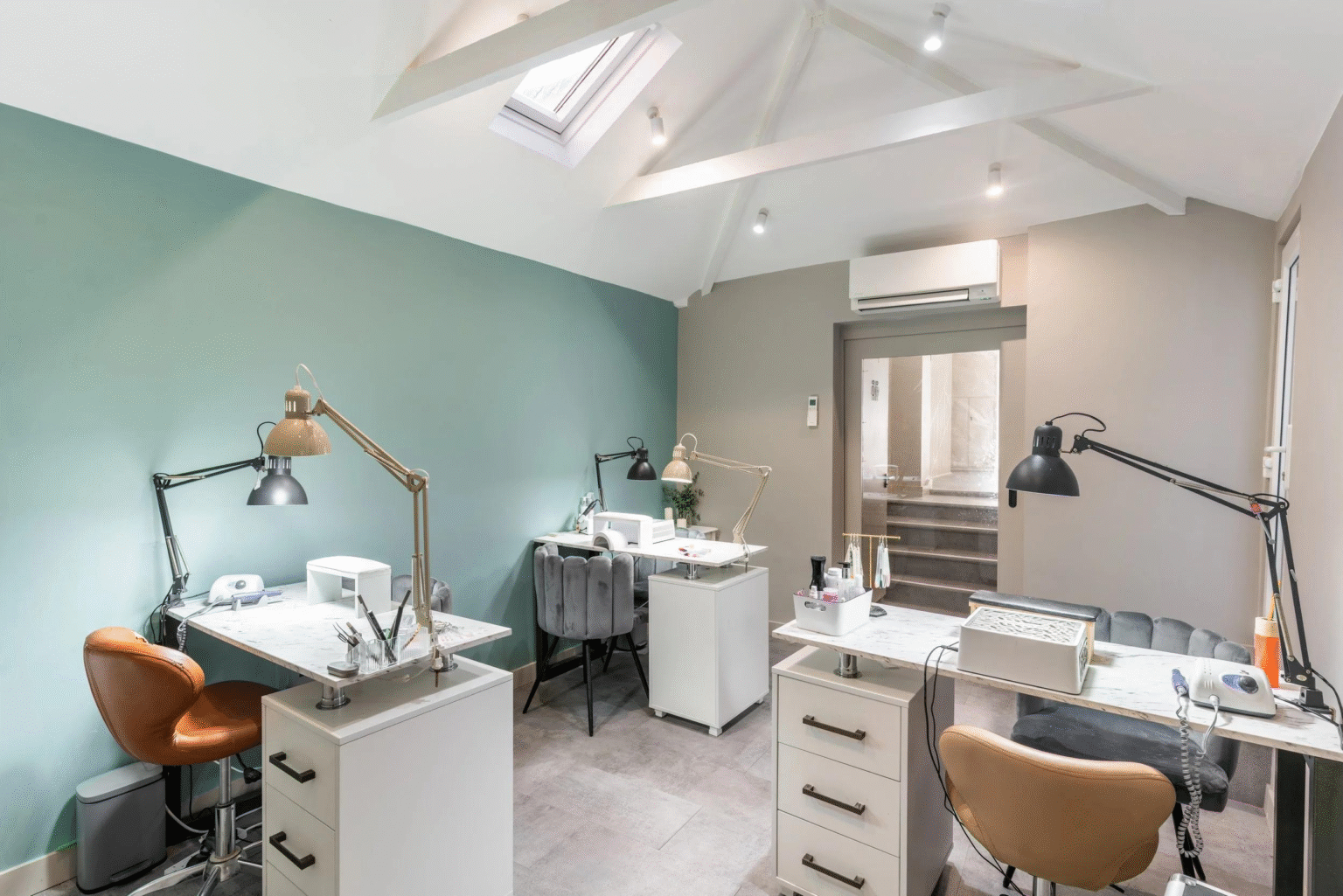 Modern nail salon workstation with professional task lighting and organized tools